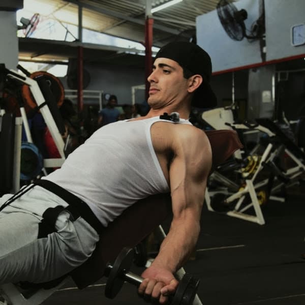 Samuel doing bicep curls